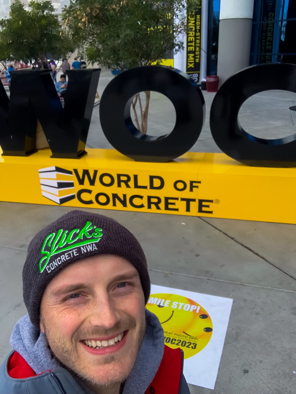 Keyan at World of Concrete wearing a Slick's Concrete NWA hat