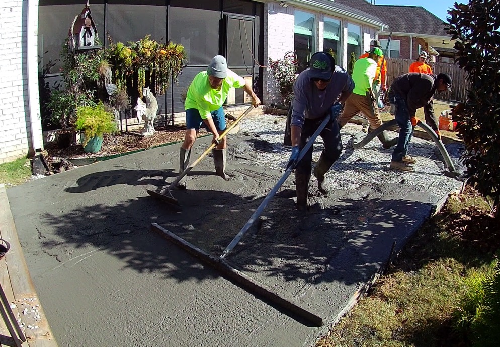 A crew placing concrete together on a residential project